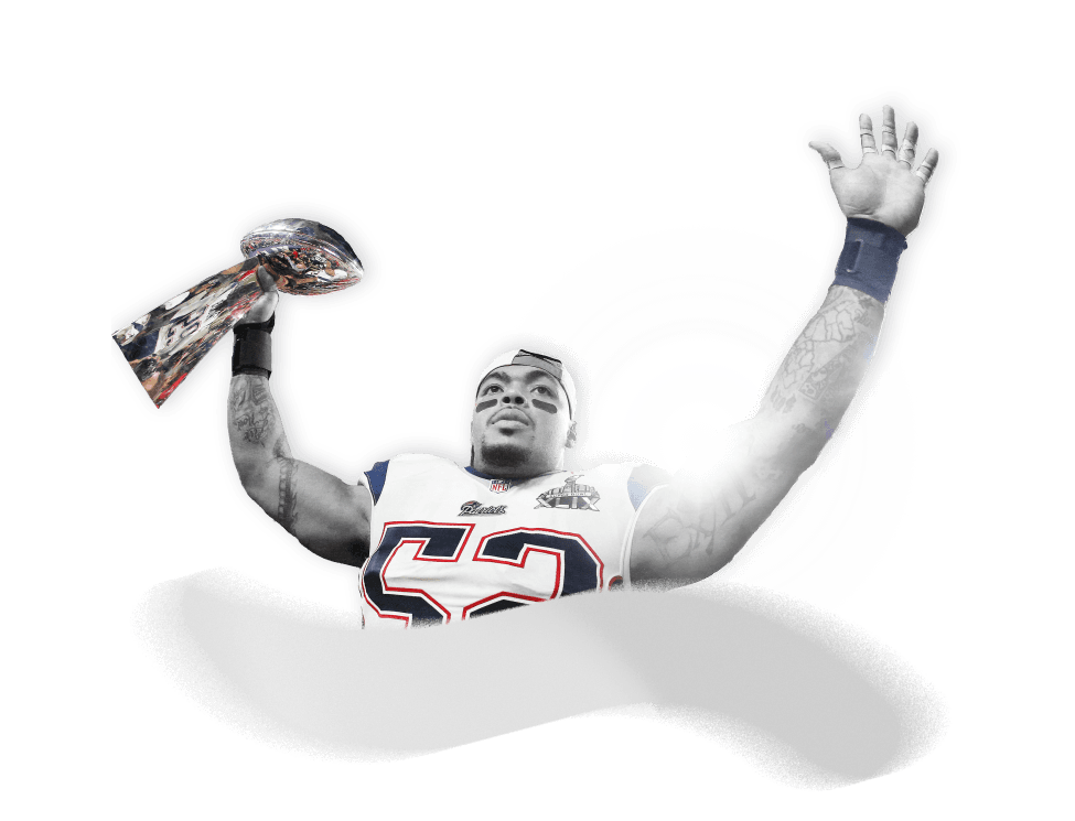 Jonathan Casillas in New England Patriots uniform celebrating with trophy