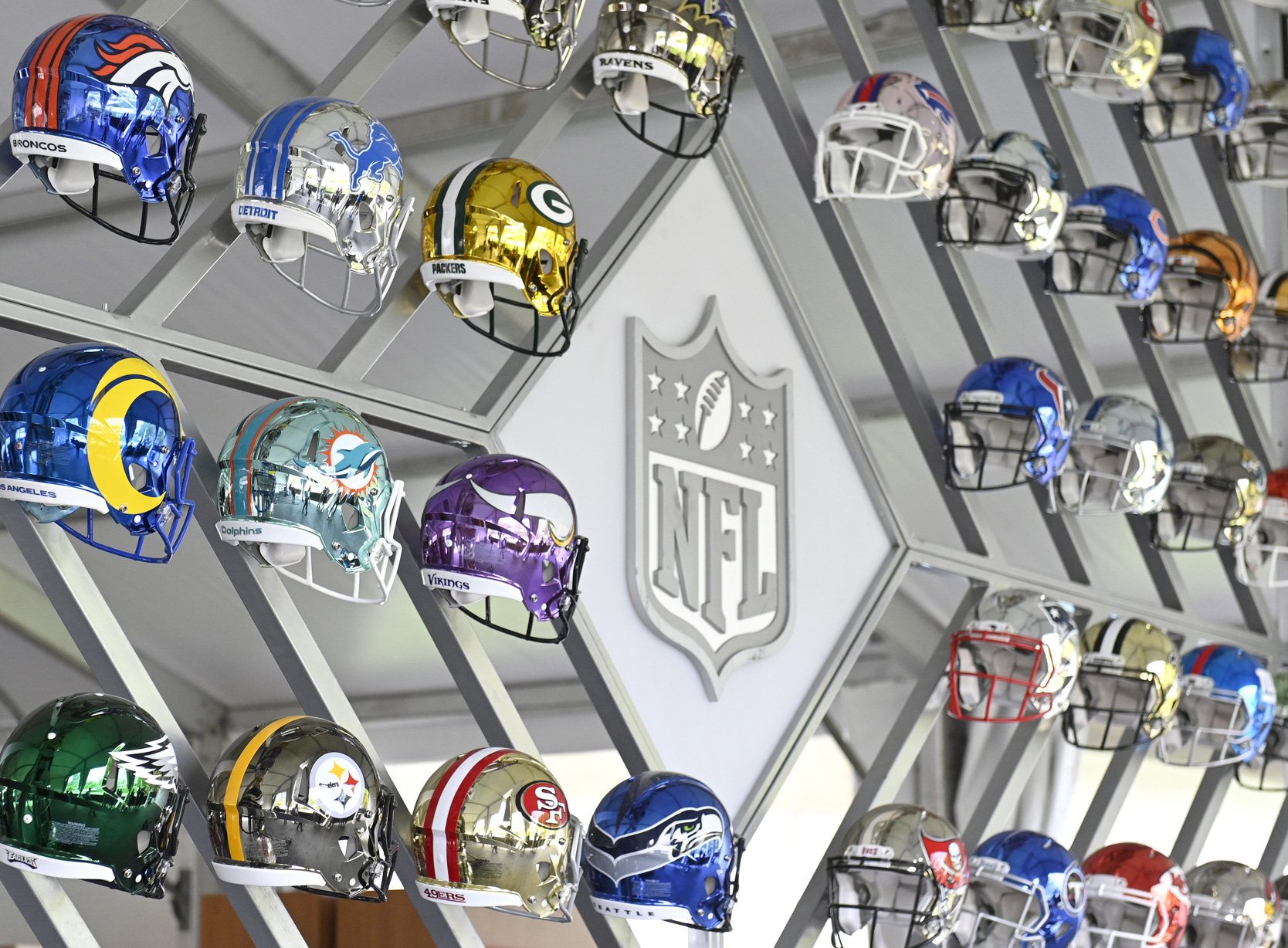 Wall display of NFL helmets